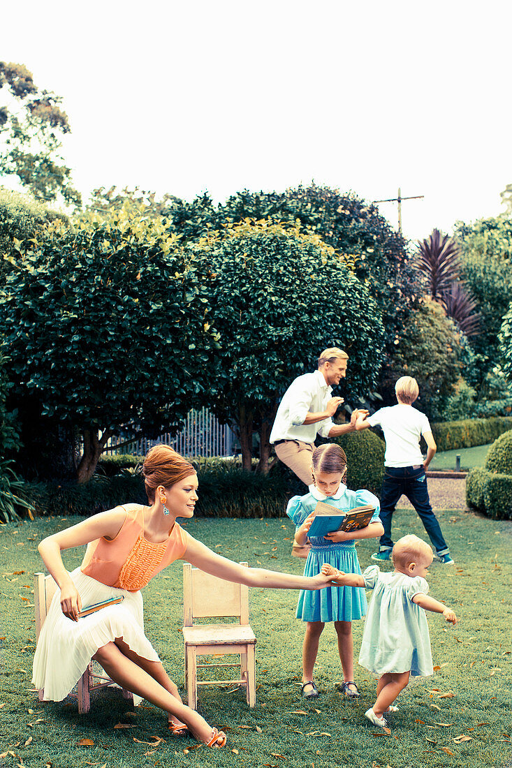 A family with three children in a garden
