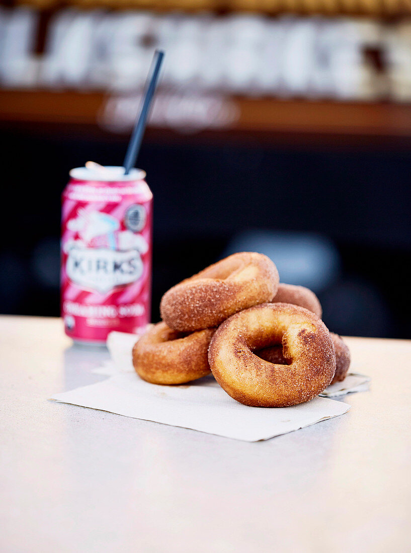 Donuts and drink can with straw