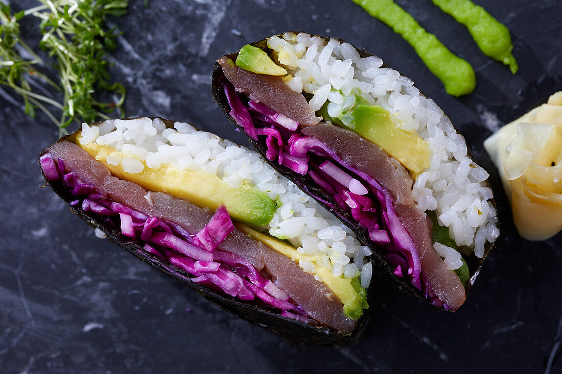 Two sushi with fish, red cabbage and avocado (India)