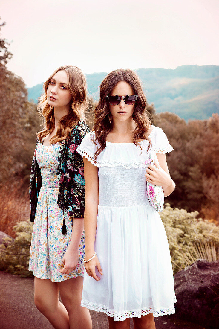 Two young women wearing summer outfits