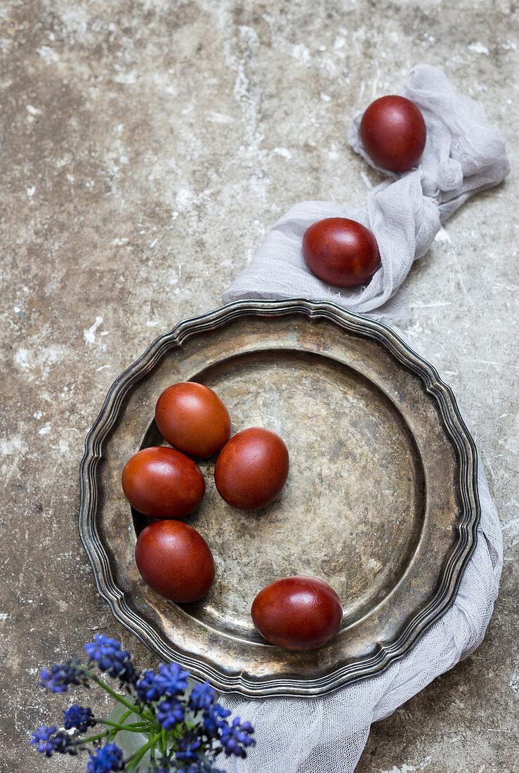 Coloured eggs on a tin plate