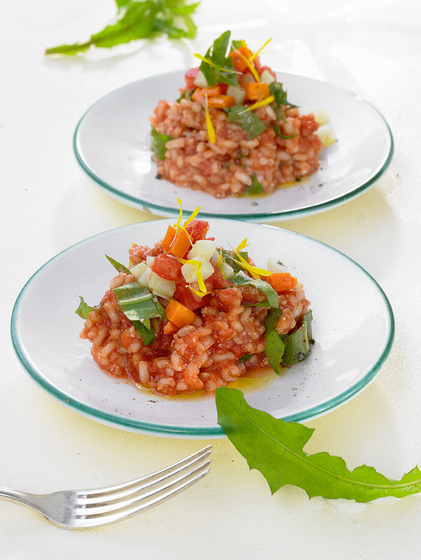 Dandelion risotto with carrots, tomatoes and kohlrabi