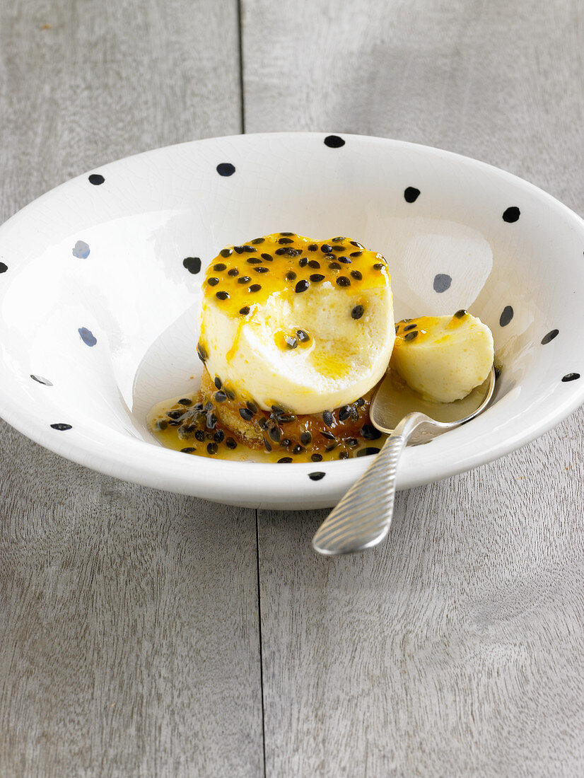 Orange pudding with passion fruit sauce