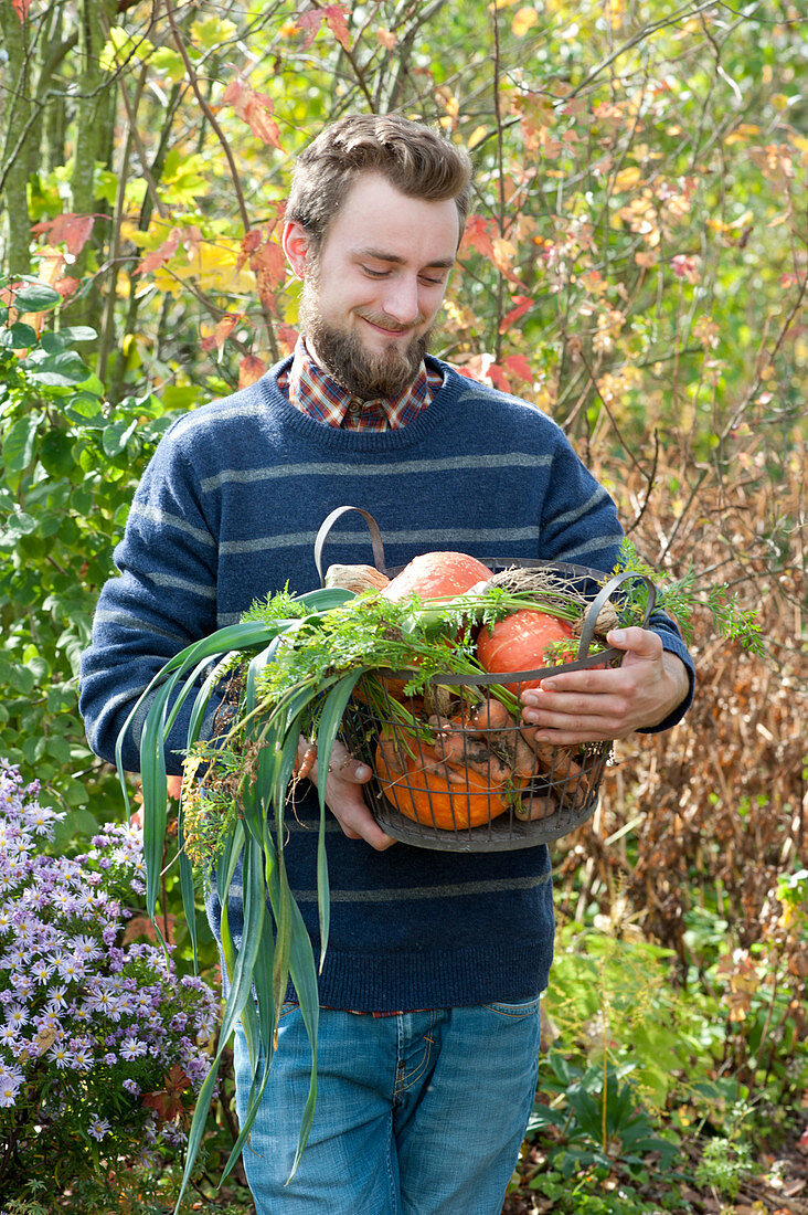 Man Bringing Basket With Freshly Harvested Vegetables