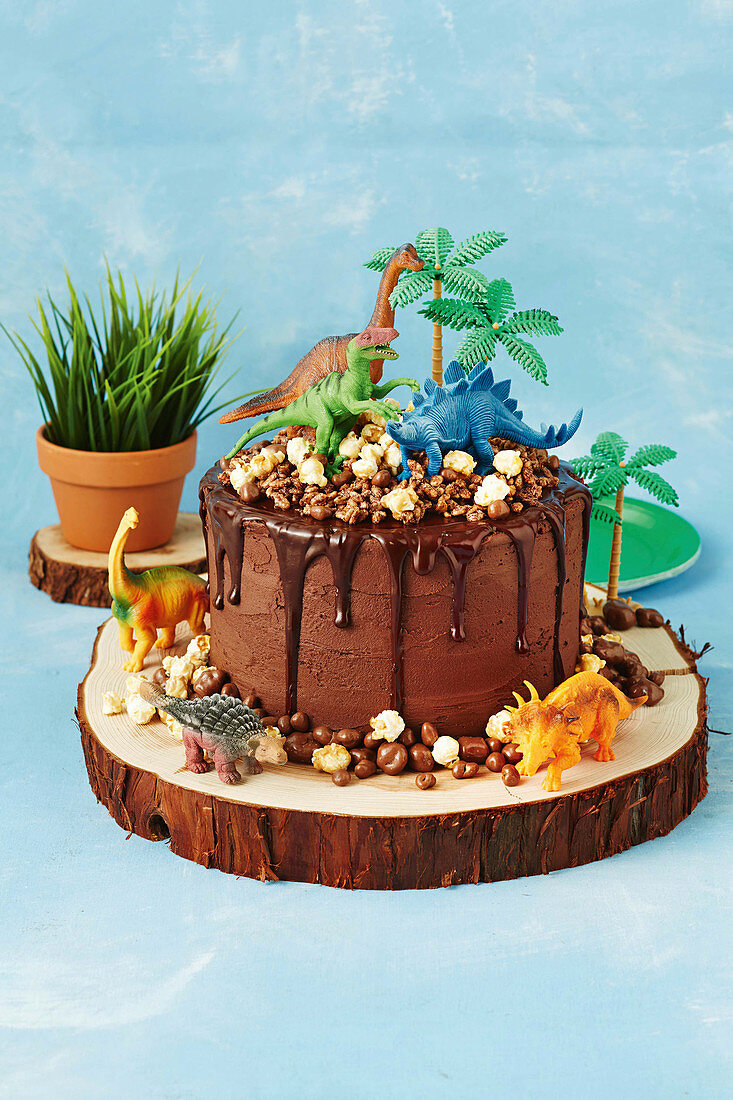 Chocolate cake decorated with dinosaurs