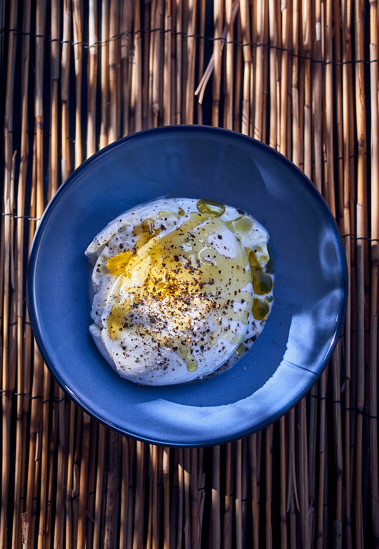 Burrata with olive oil and freshly ground pepper