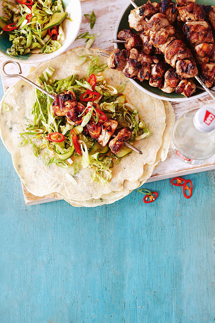 Asian five-spice chicken skewers with coriander pancakes