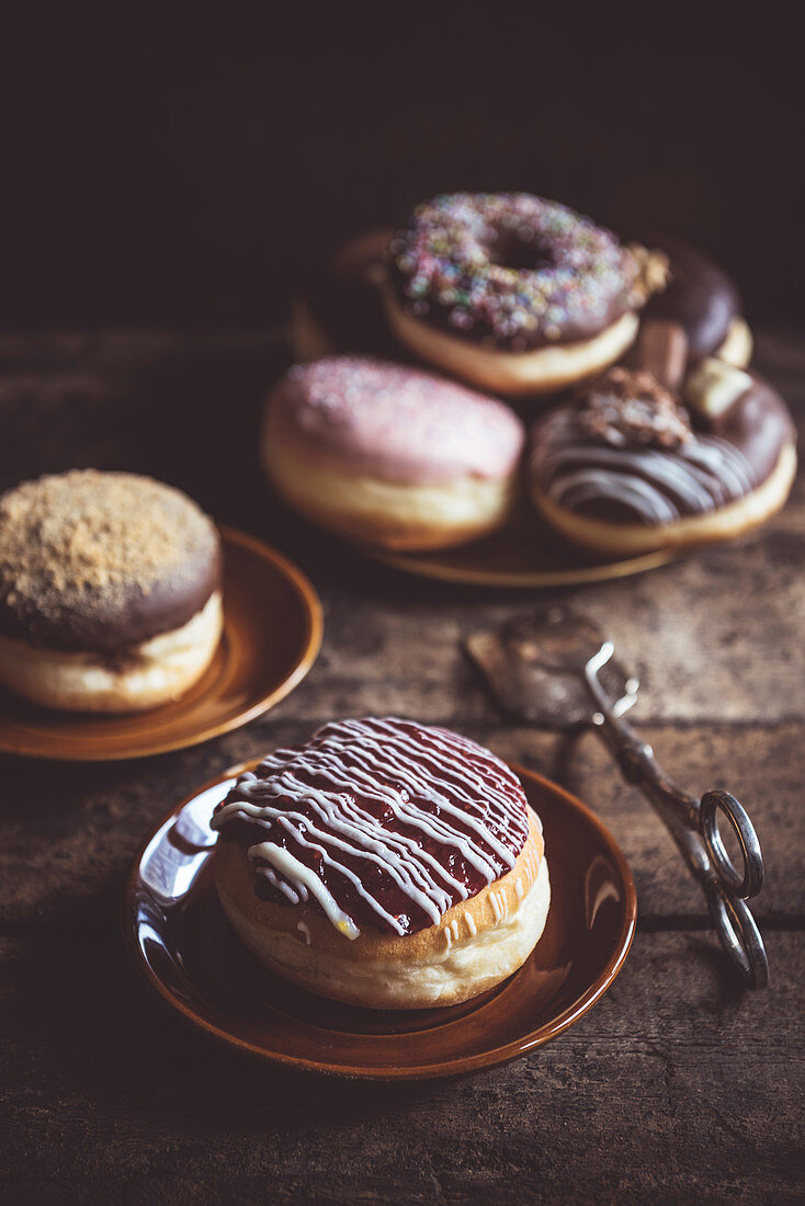 Sweet homemade donuts served on the wooden table, selective focus