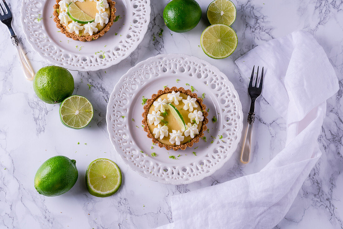 Key lime pie tartlets with cream flowers