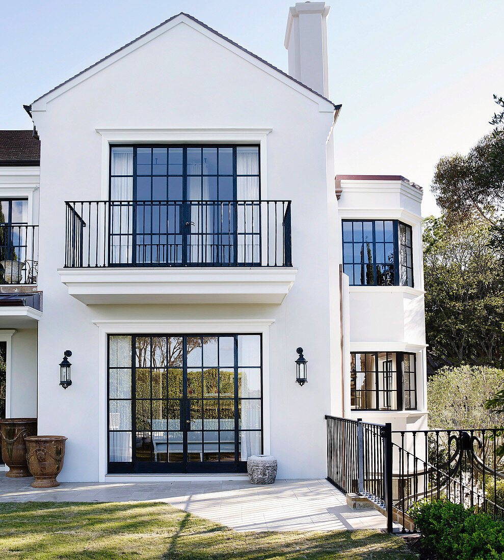 Facade of a two-story house with lattice … – License image – 12444302 ...