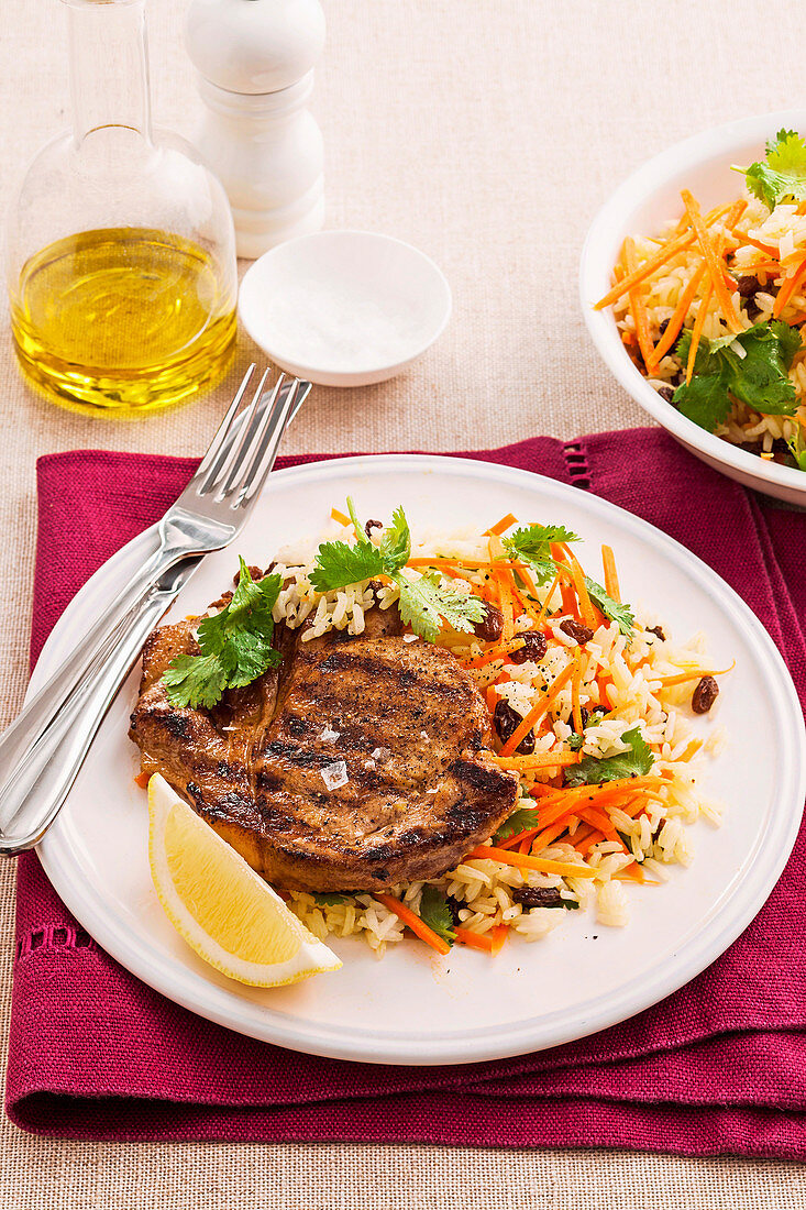 Cumin pork chops with rice and carrot salad