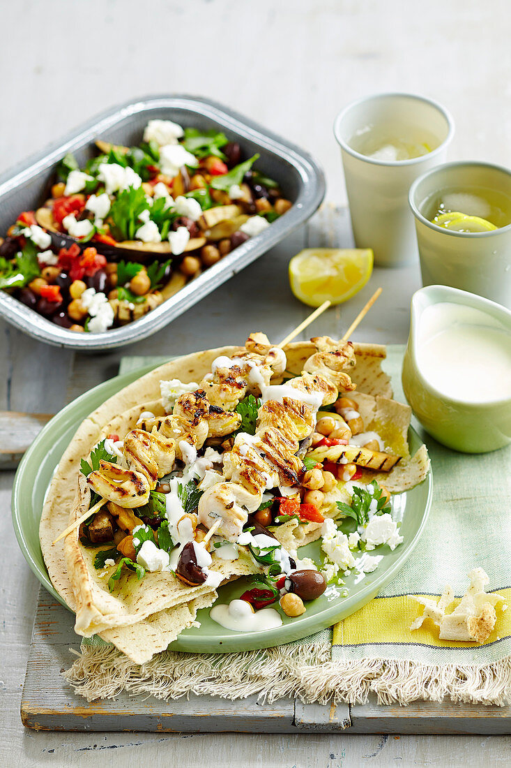 Greek chicken skewers with warm eggplant salad