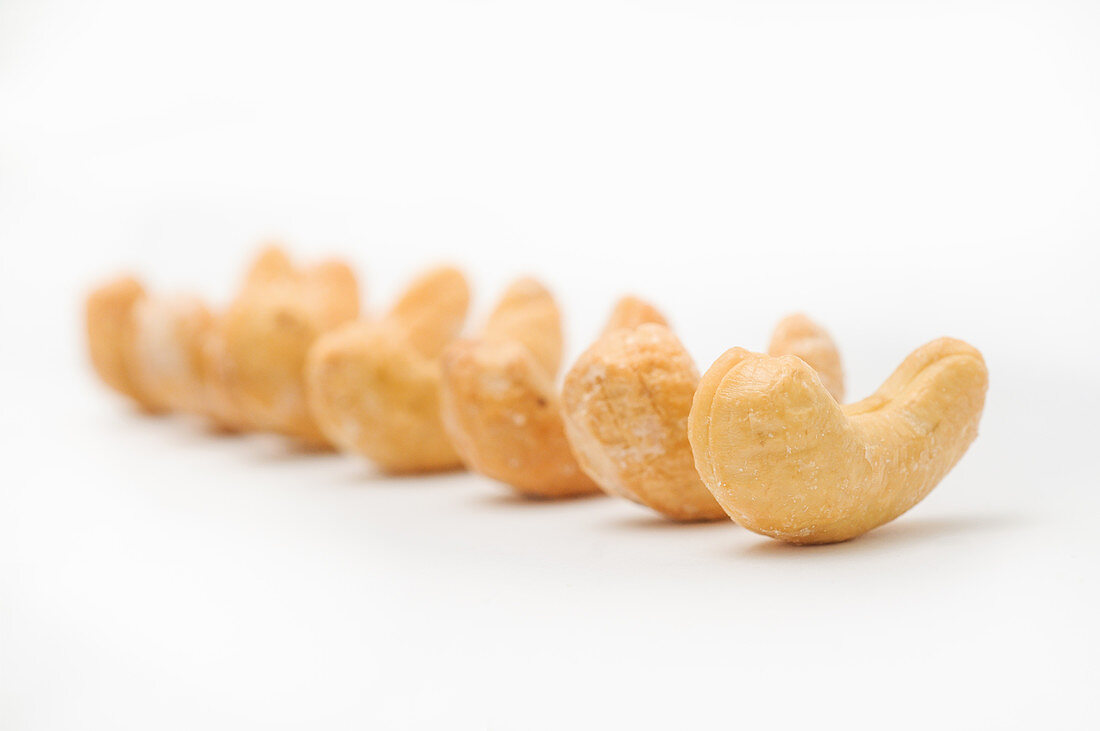 Roasted and salted cashews in a row