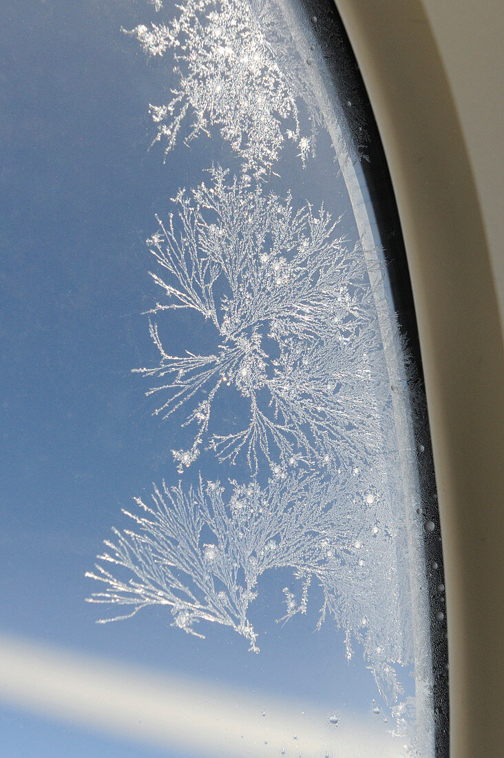 Ice crystals on aircraft window