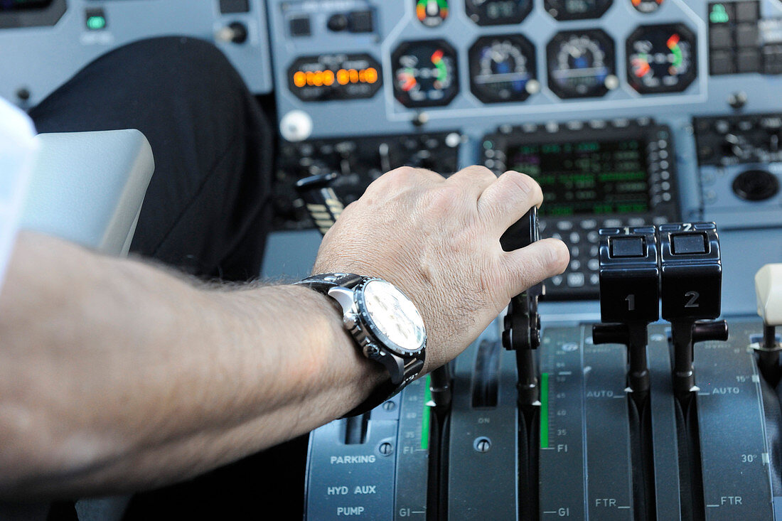 Pilot's hand on throttle