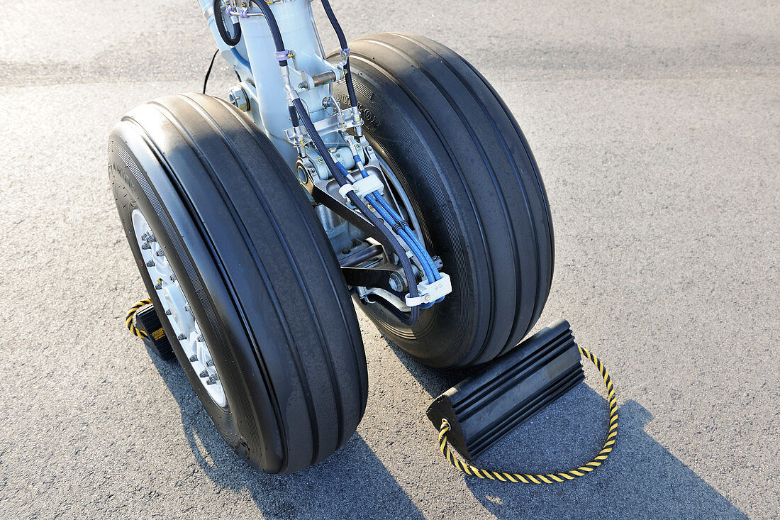 Turboprop passenger aircraft wheel and chock