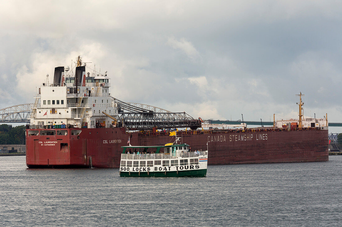 Tour boat and cargo ship, Soo Locks, Michigan, USA