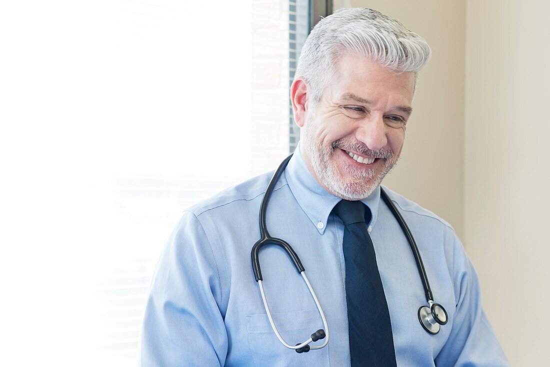 Mature doctor smiling