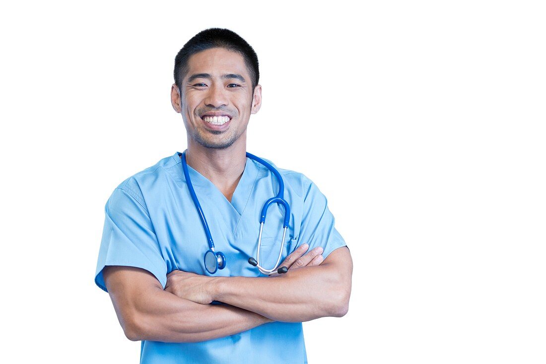 Male doctor smiling towards camera