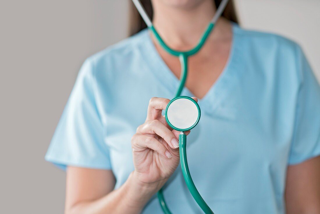 Female doctor holding stethoscope