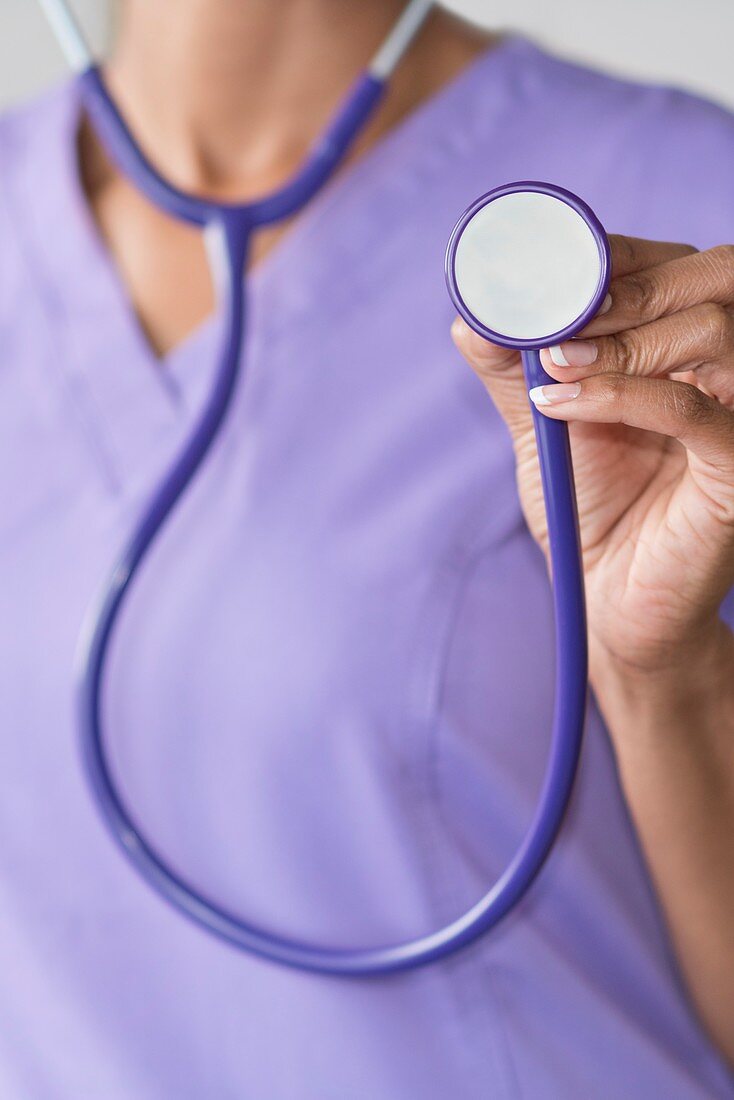 Female doctor holding stethoscope