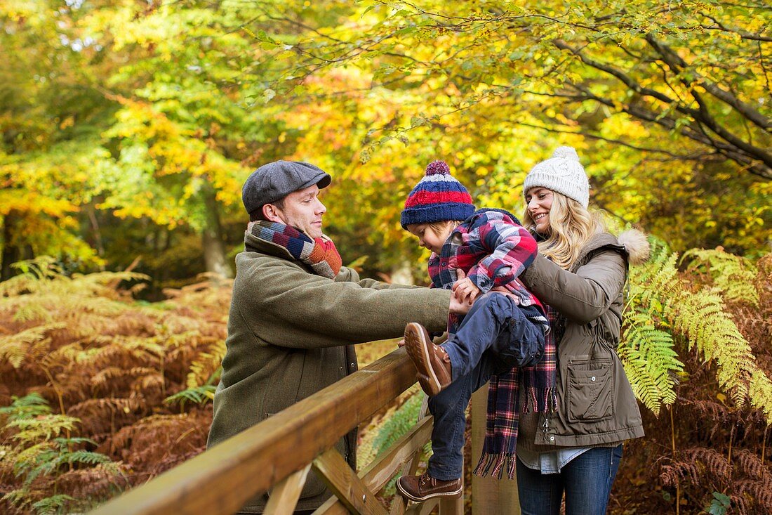 Family in woods in Autumn