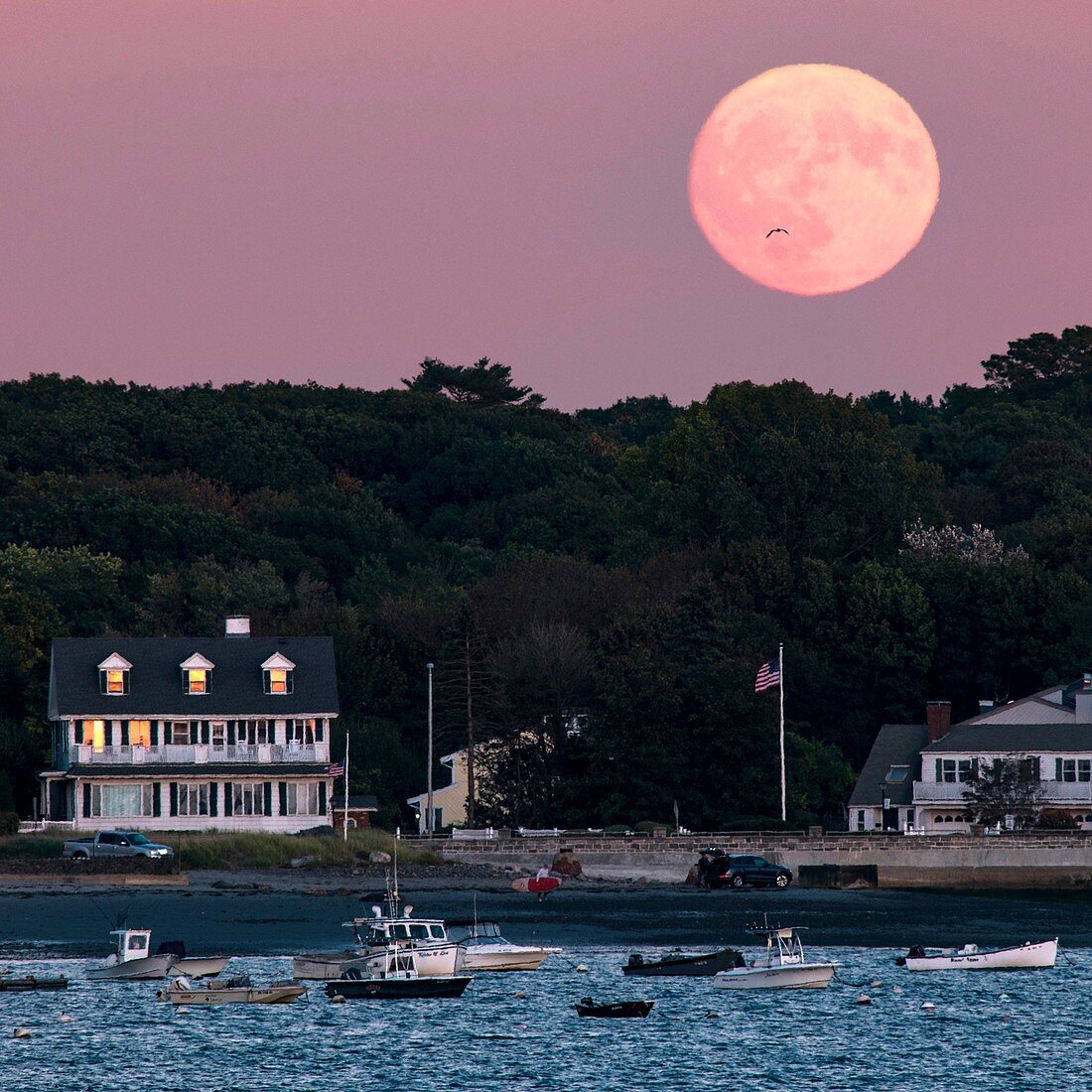 Full moon over coastal houses