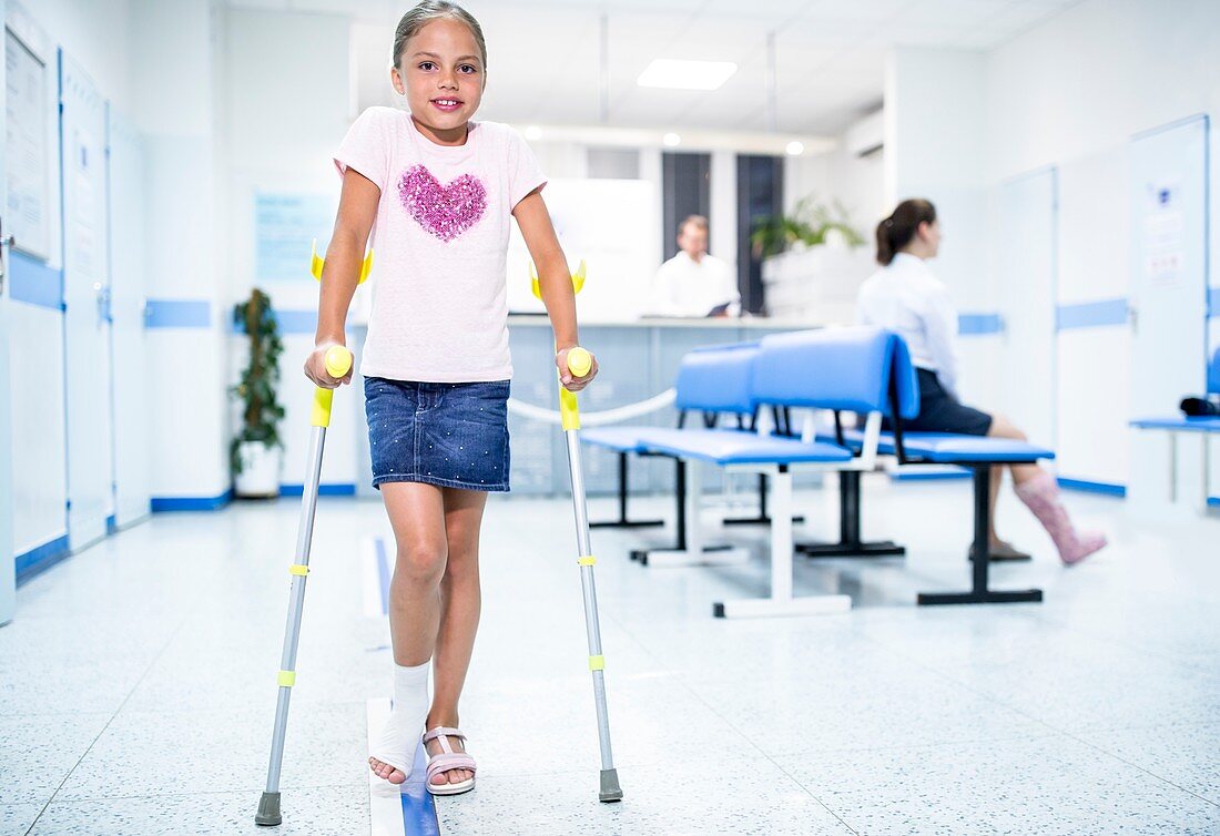 Girl walking with crutches