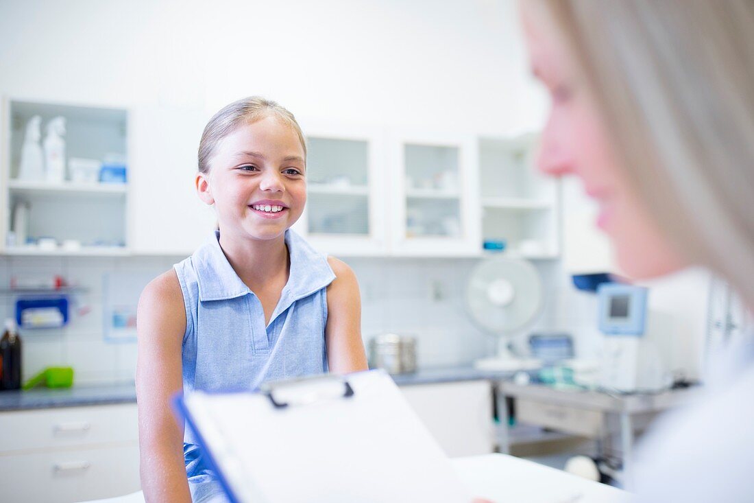 Doctor examining girl