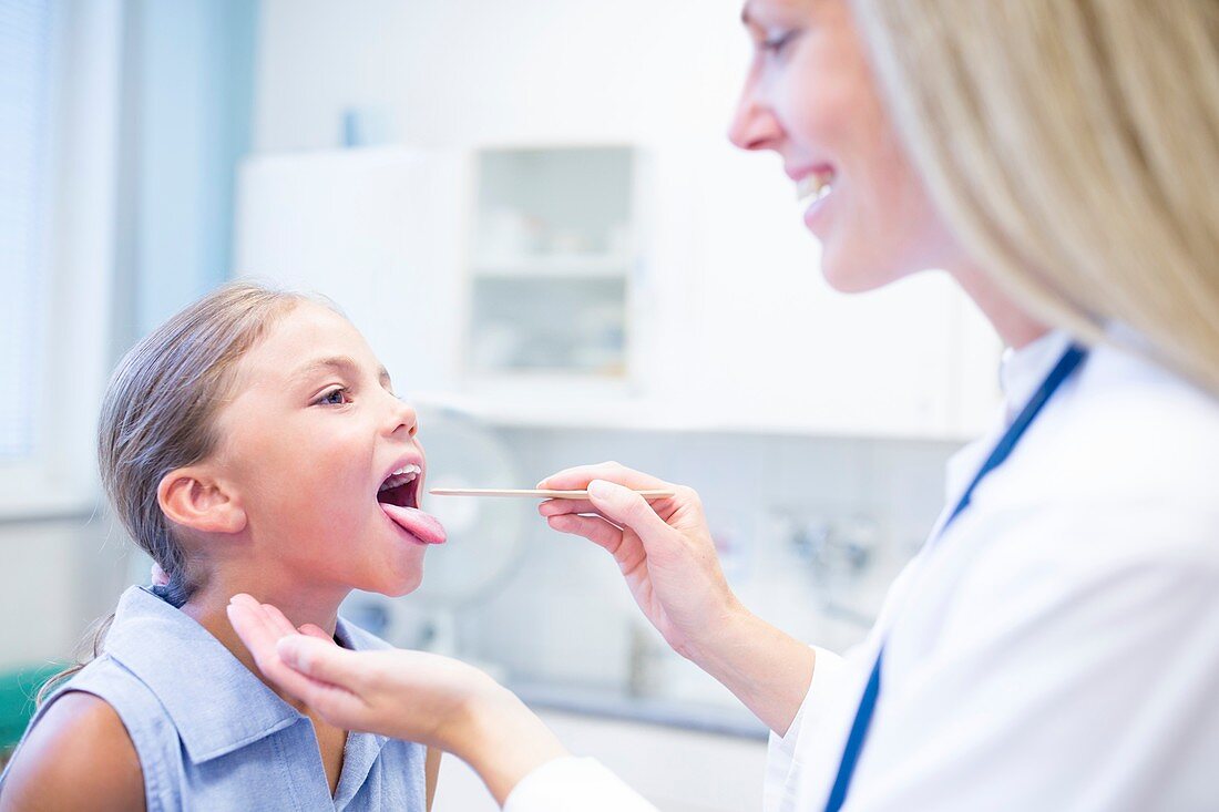 Doctor examining girl