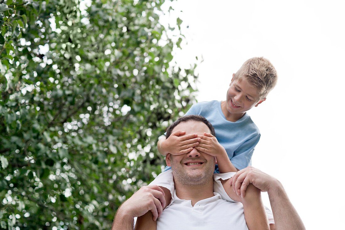 Father carrying son on his shoulders