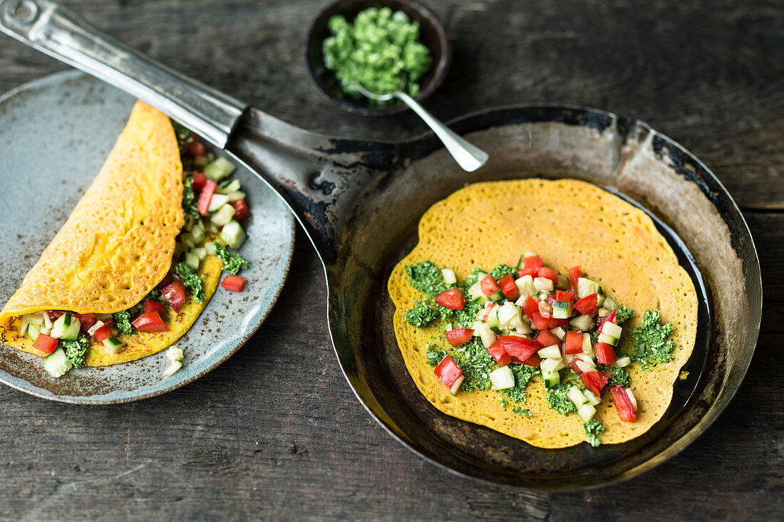 Indian mung bean pancakes with vegetables and coriander chutney