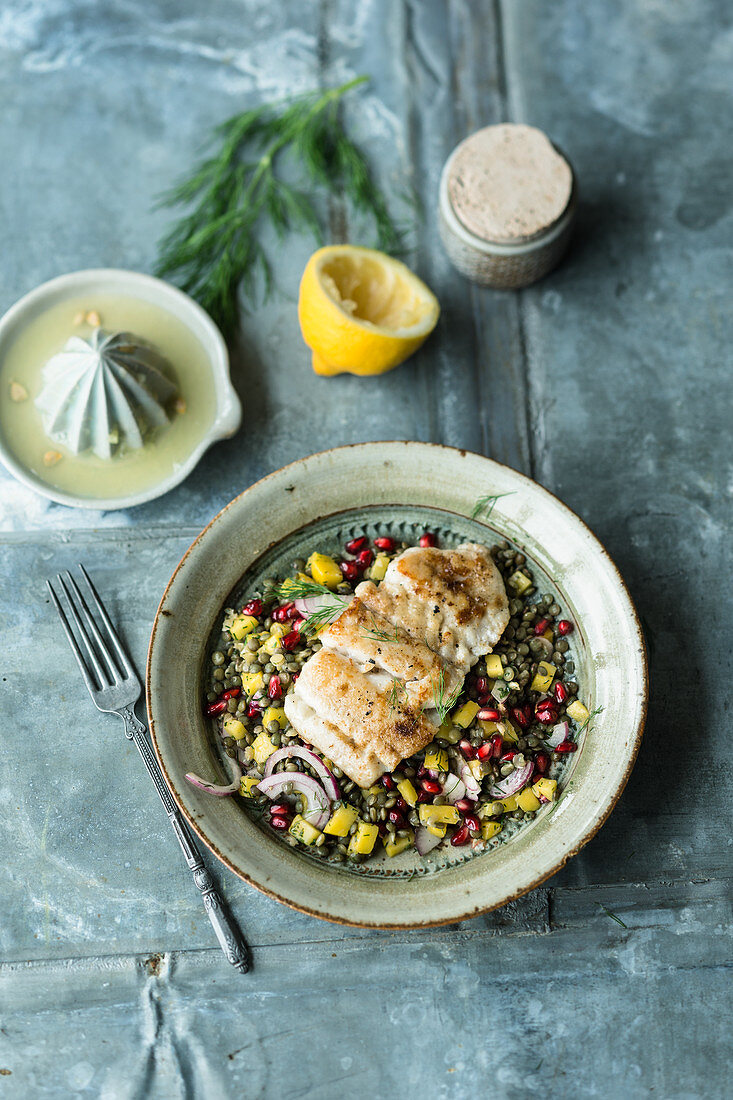 Fruity puy lentil salad with fish, mango and pomegranate seeds