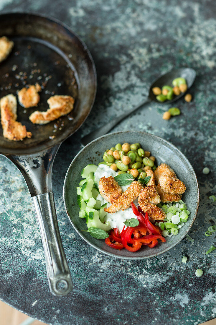 Oriental bowl with sesame seed chicken