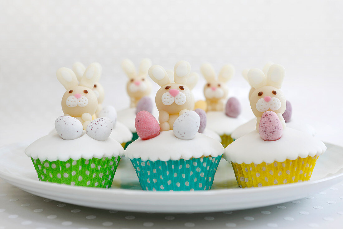 Easter cupcakes with marzipan bunnies and chocolate eggs