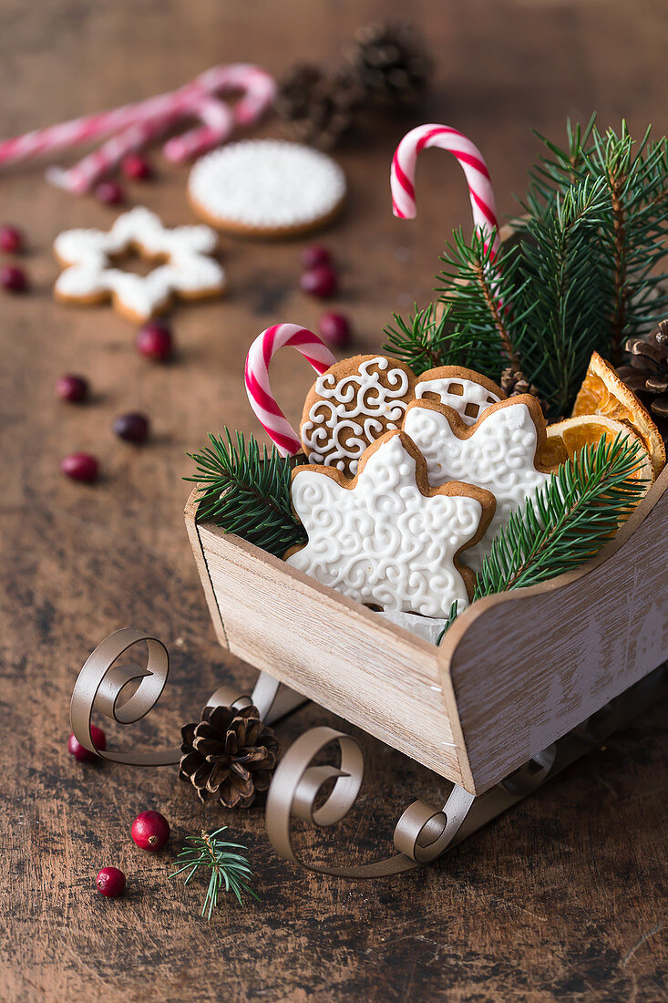 Gingerbread cookies in a decorative wooden sleighs