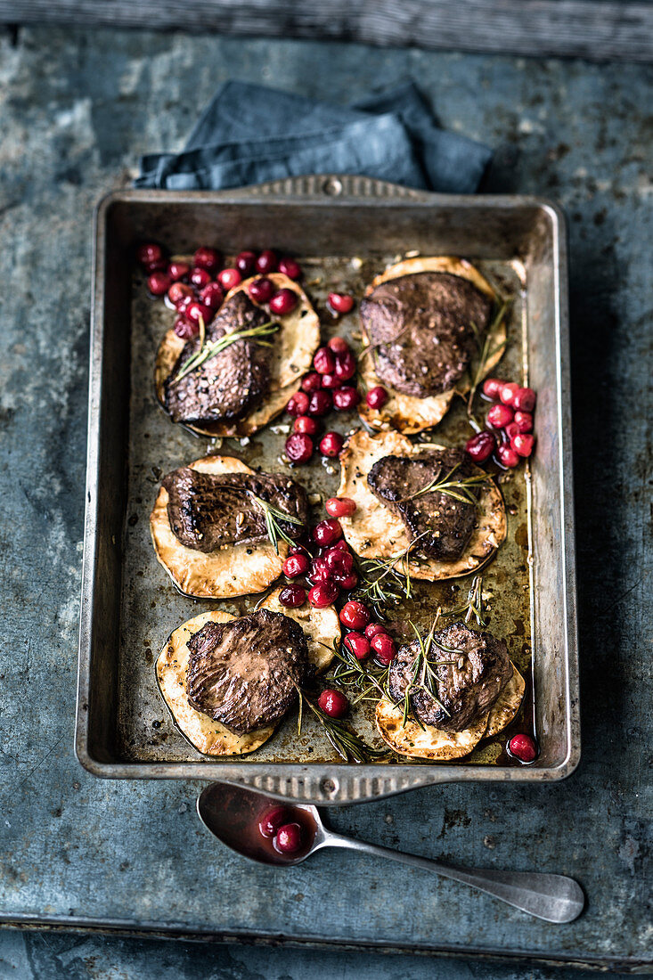 Venison medallions with cranberries and celeriac