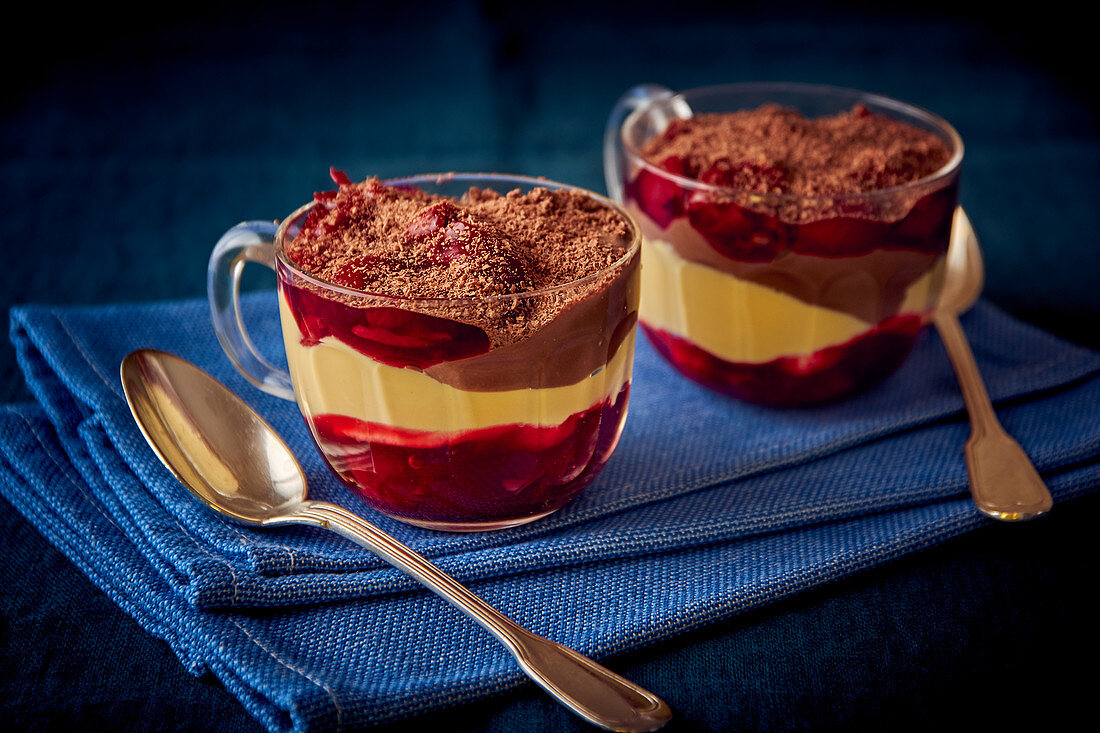 Layered chocolate, mango, and cherry desserts