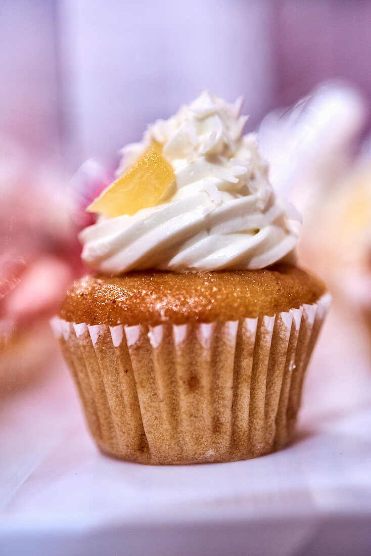 A cupcake topped with coconut buttercream