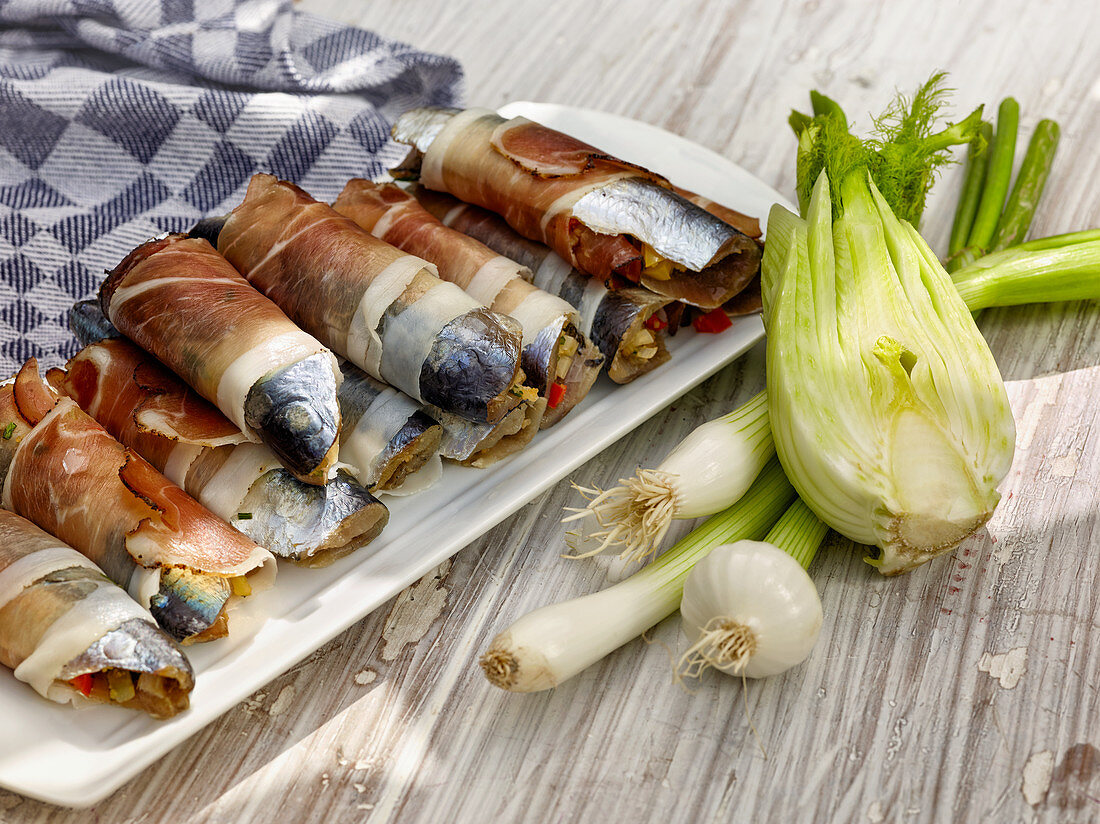 Stuffed, grilled sardines wrapped in bacon