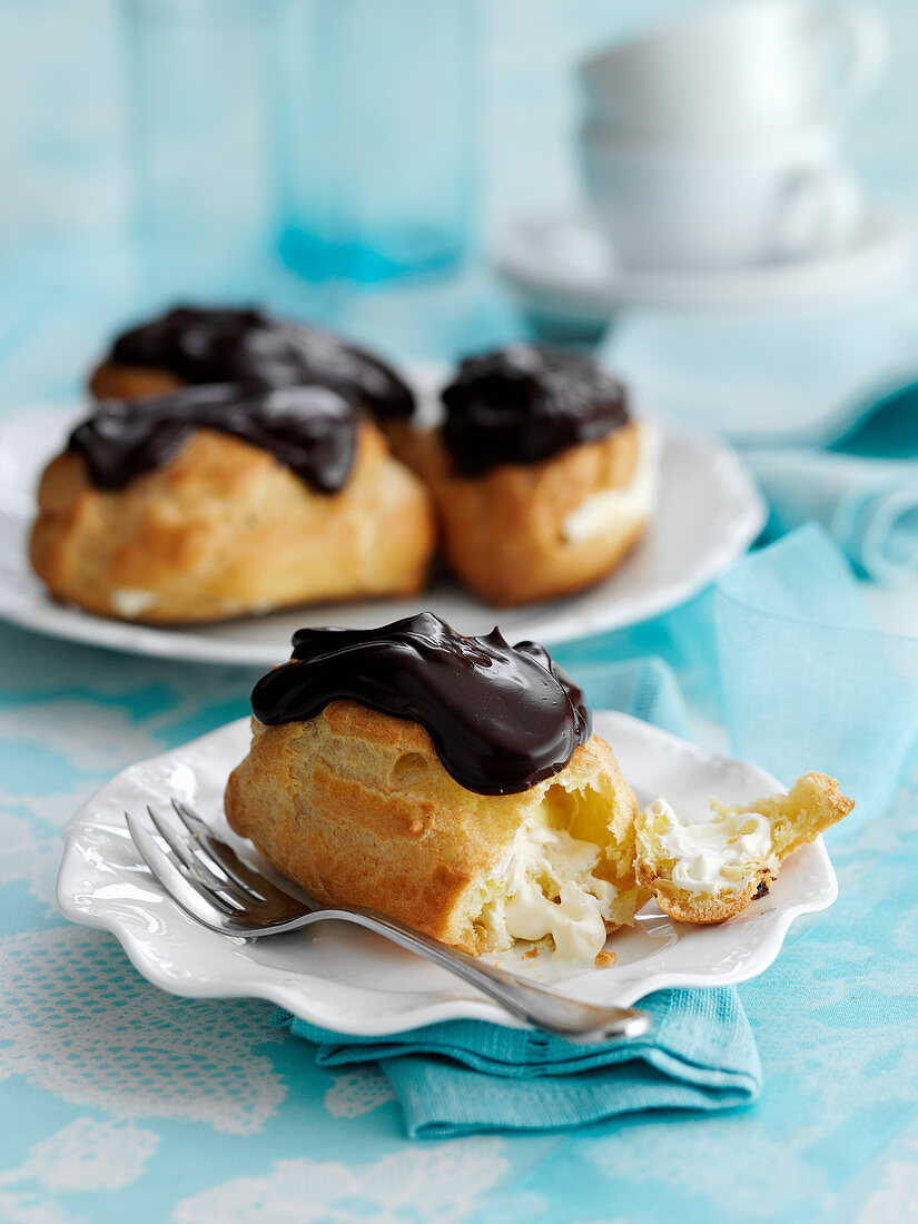Eclairs topped with chocolate