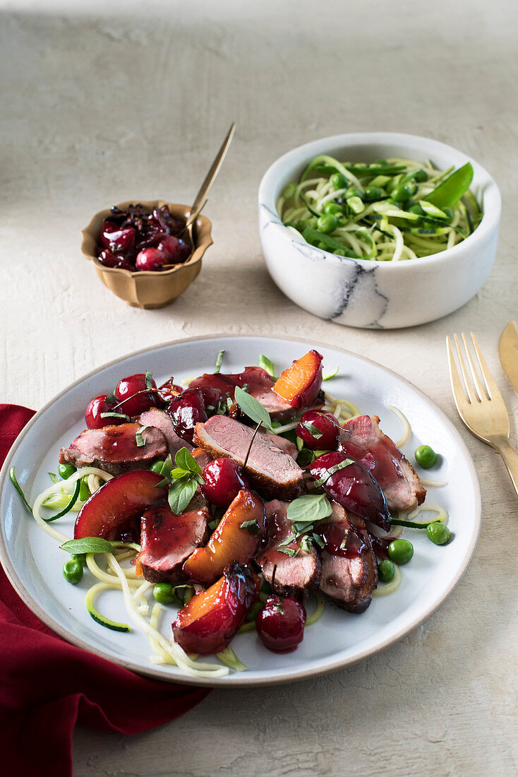 Duck breast with cherry and plum salsa and zucchini noodles