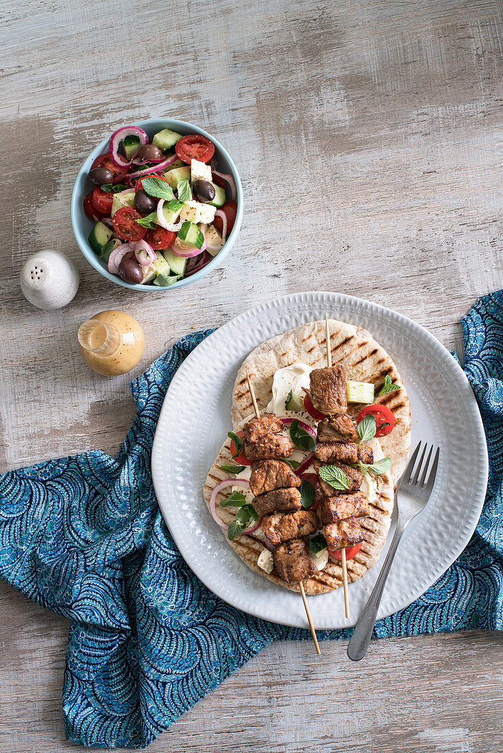 Souvlaki with flatbread and greek salad (Greece)