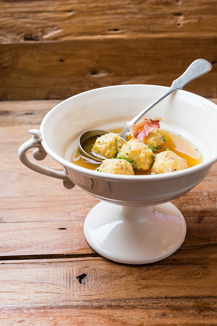 Clear broth with bacon dumplings