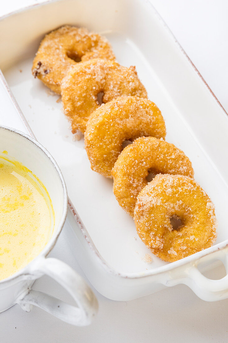 Apple doughnuts with vanilla sauce