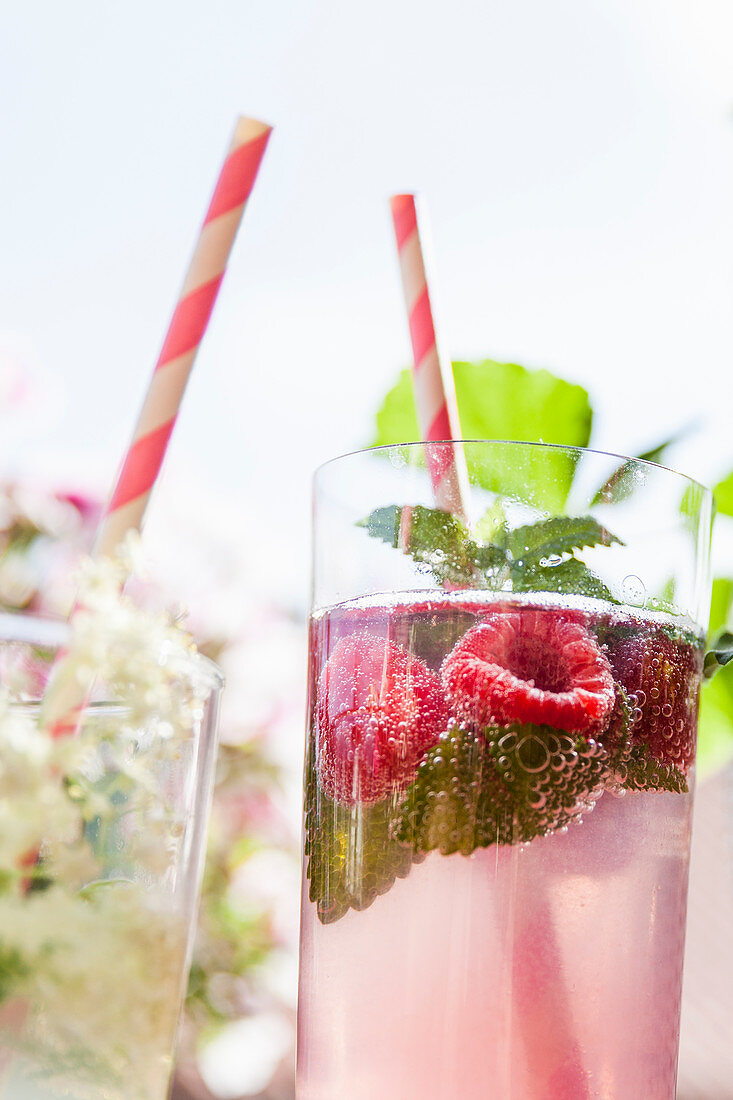 A glass of raspberry and mint infused water