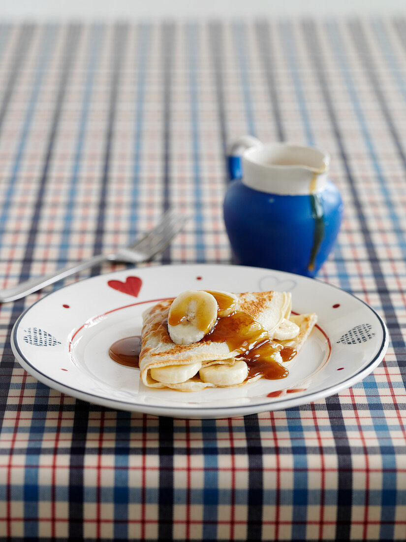 Crepes with bananas and butterscotch sauce