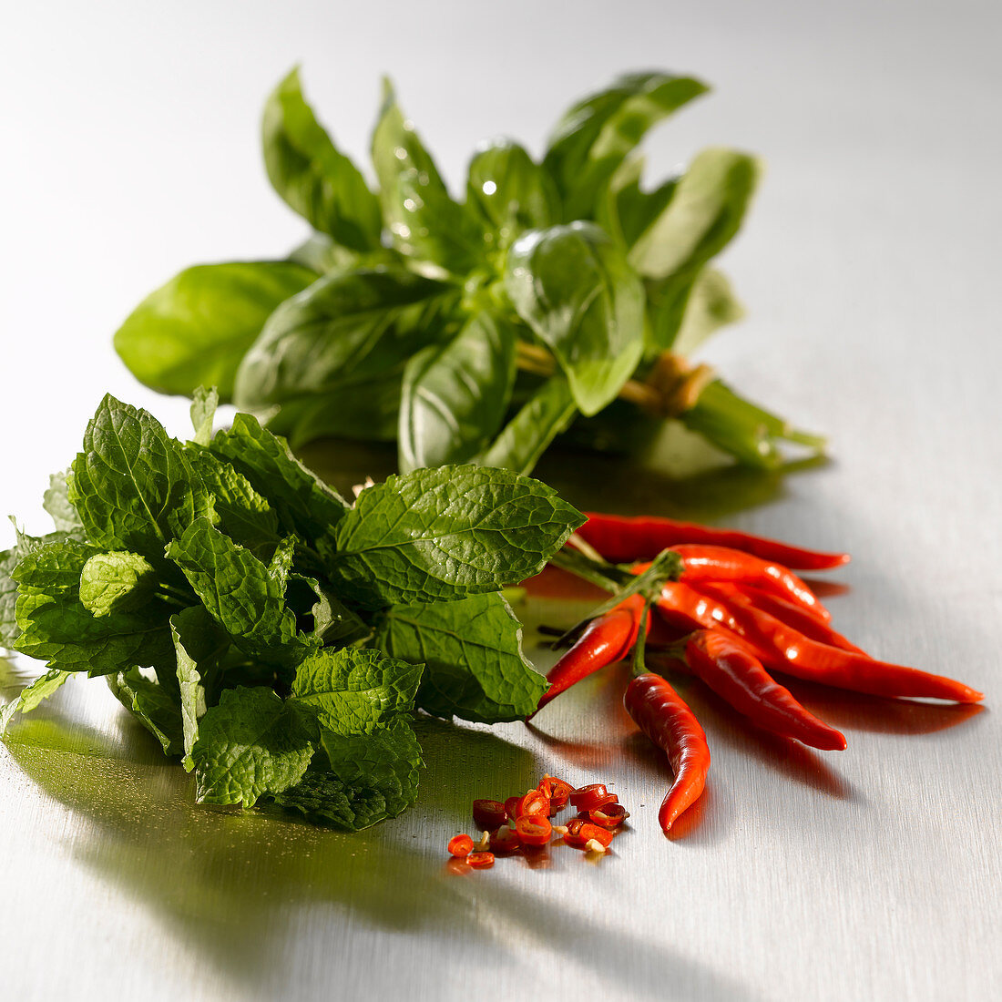 Fresh chili peppers, basil and mint