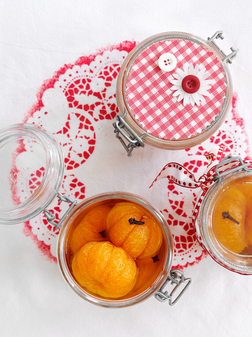 Pickled clementines in glass jars