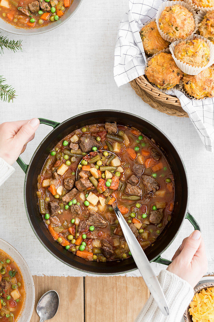 Vegetable beef soup with a person